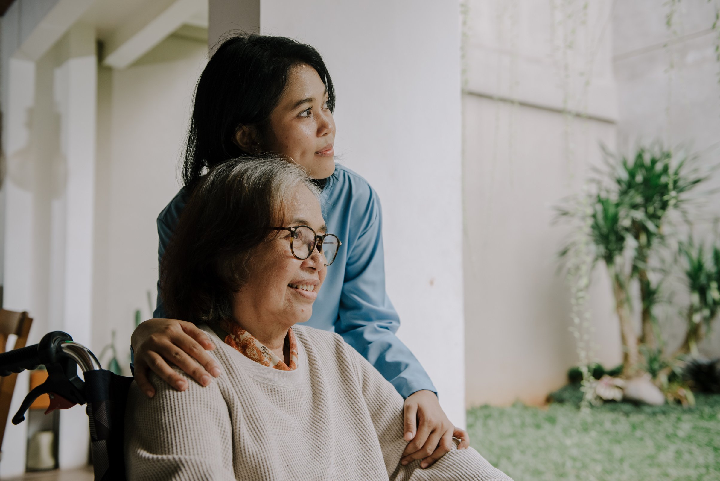 Nurse Taking Care of an Elderly Woman 